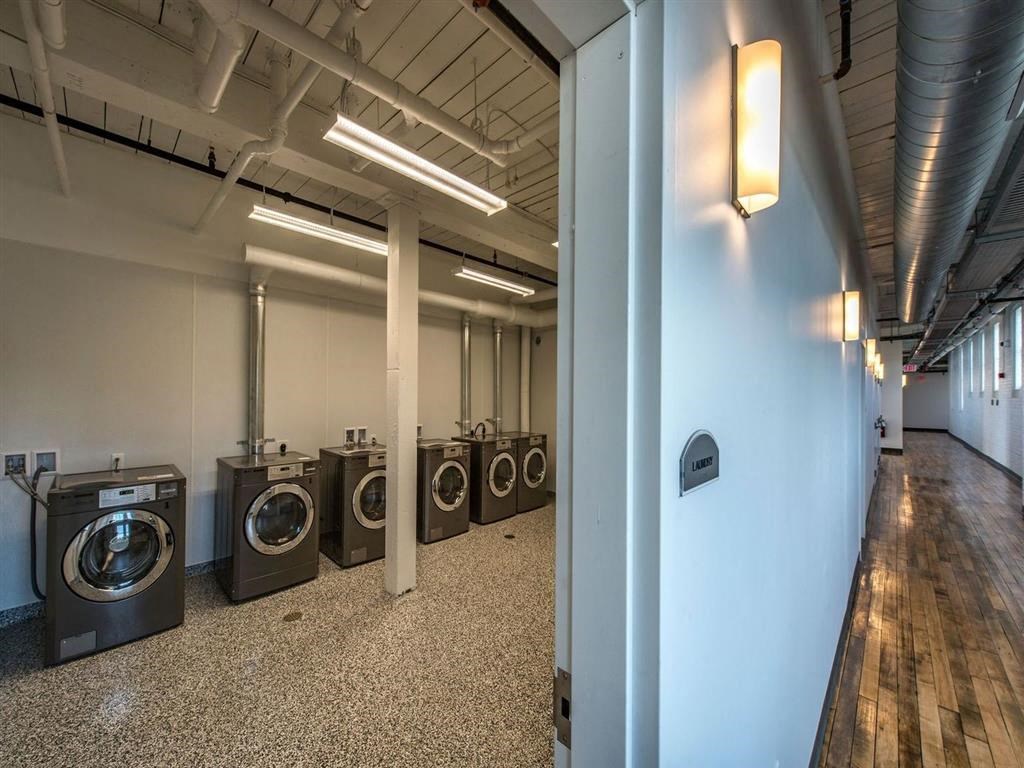 a group of washing machines in a room