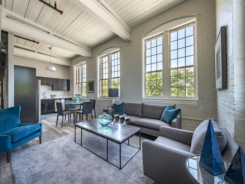 a living room with a couch and a table