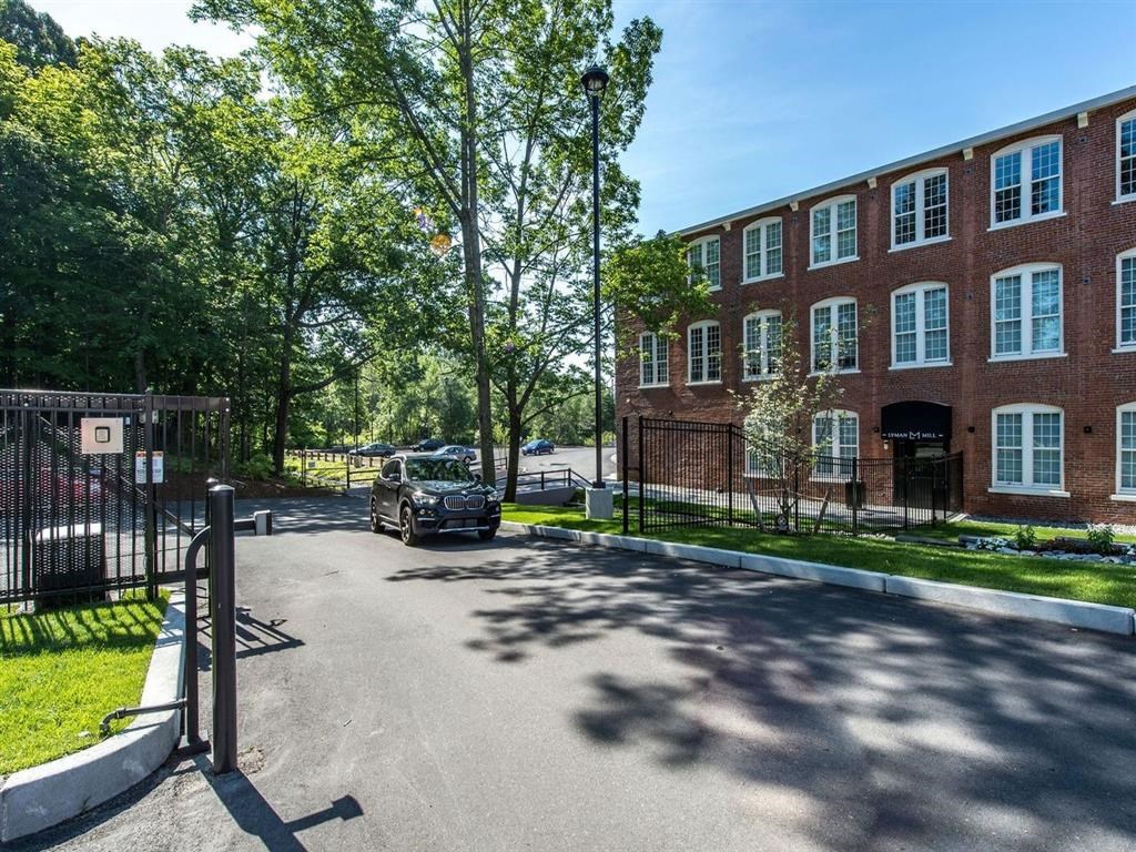 a car parked in front of a brick building