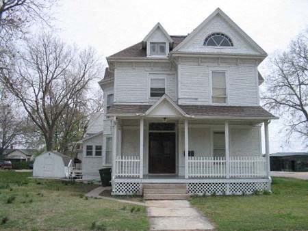 a white house with a porch and