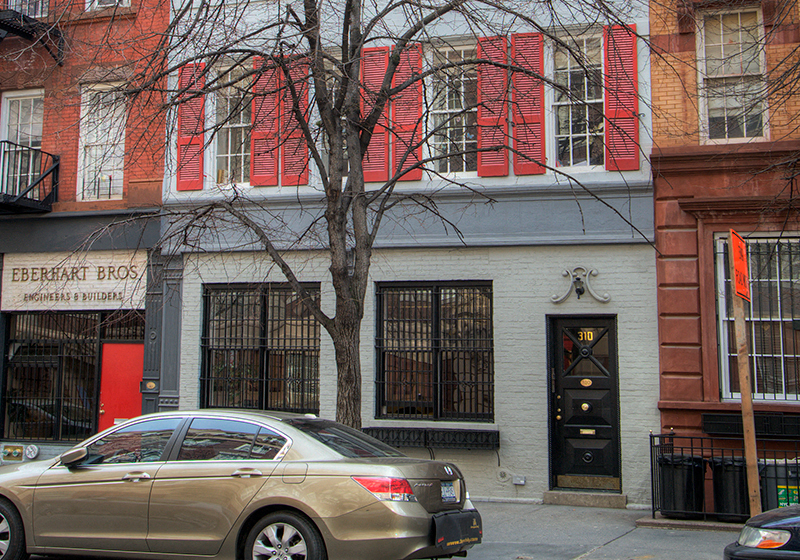 a car parked in front of a building on a city street