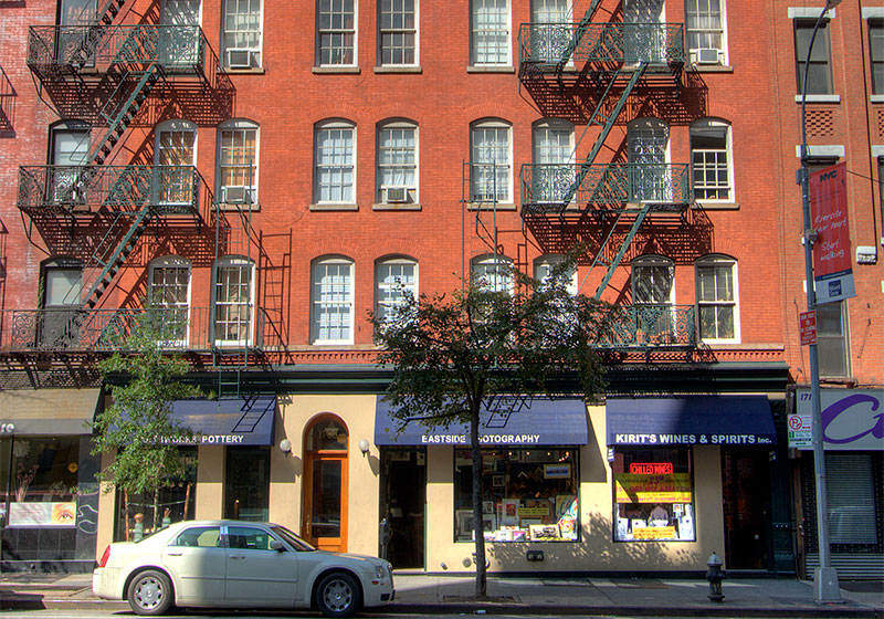 a car parked in front of a building on a city street