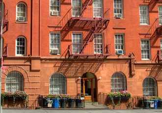 a red brick building with a fire escape