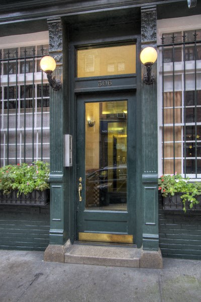 the front door of a building with a glass door