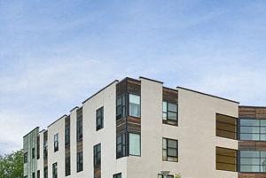 a group of buildings on the side of a street