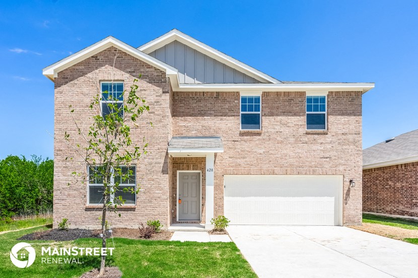 a brick house with a white garage door