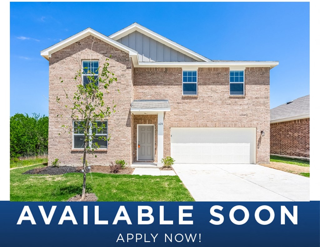 a updated brick home with a white garage door