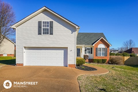 a white house with a white garage door