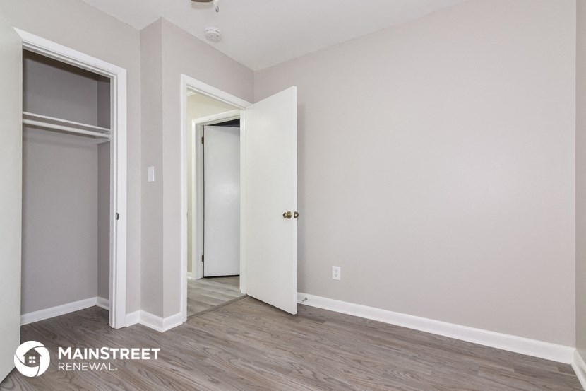 the interior of a renovated apartment with white walls and wood floors