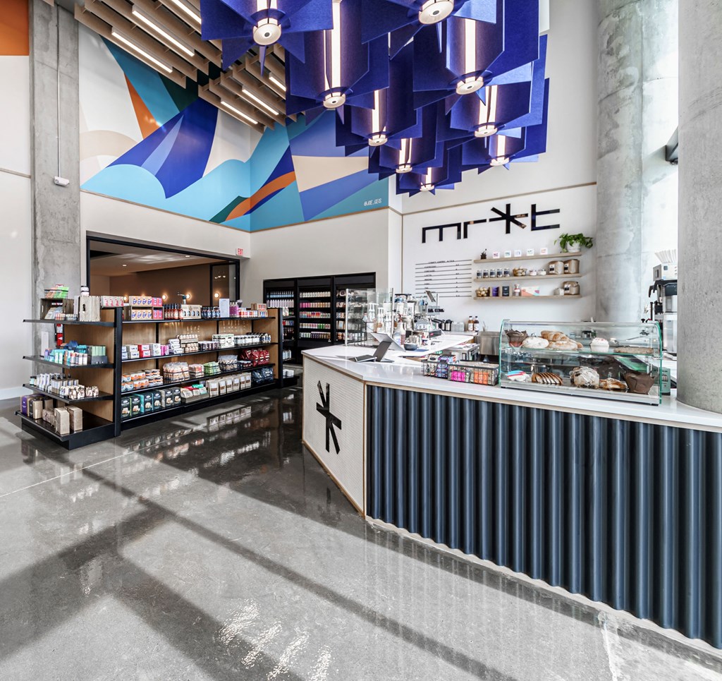a supermarket with a counter and a colorful design on the wall