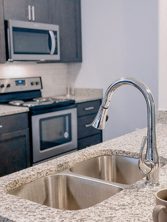 Sink With Faucet In Kitchen at The Ivy at Berlin Place, South Bend, IN, 46601