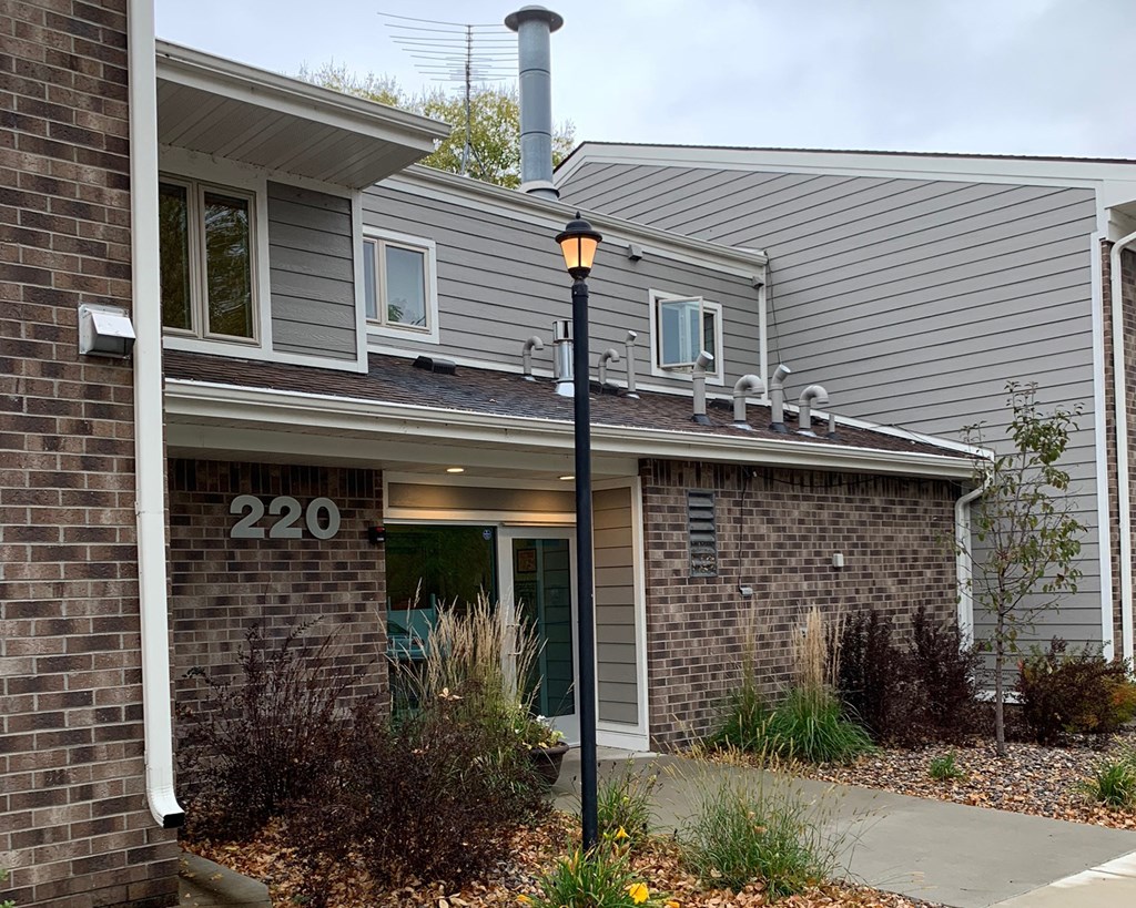a building with a street light in front of it