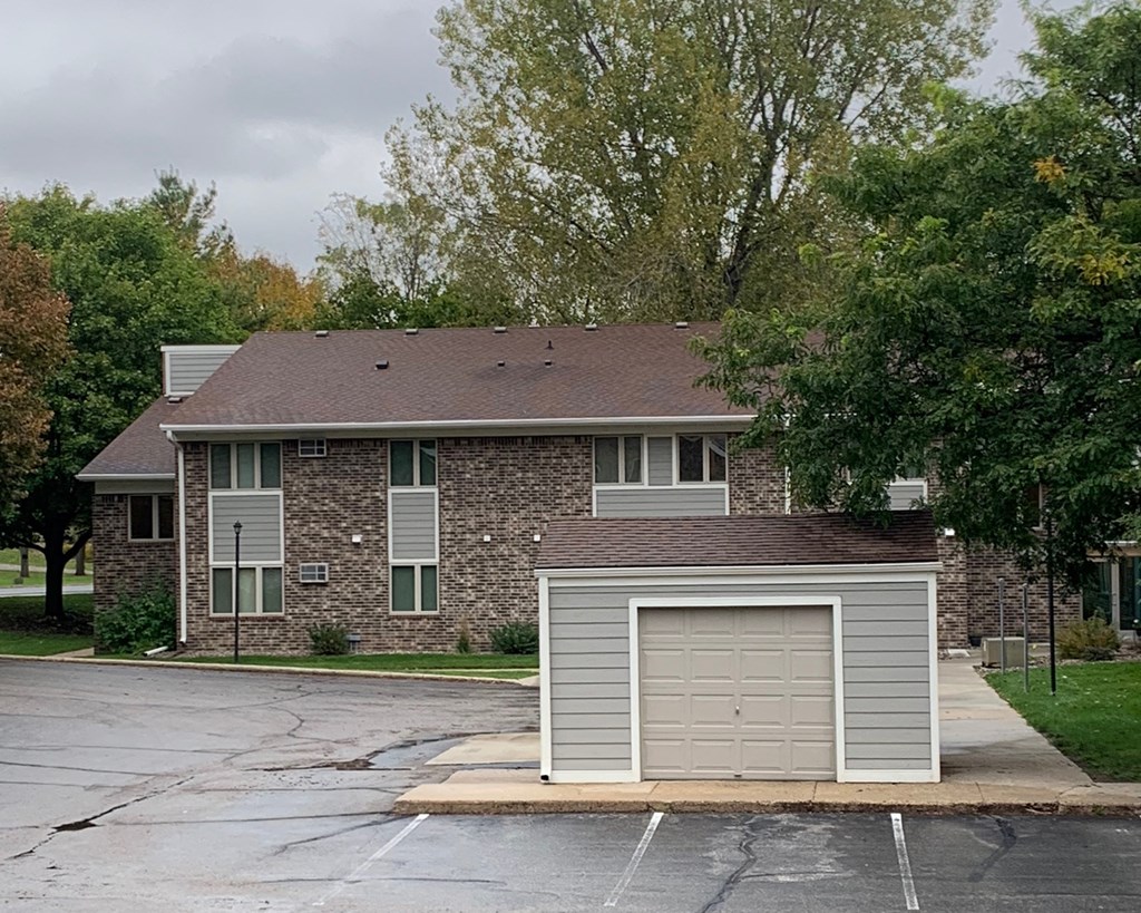 a brick house with a white garage door