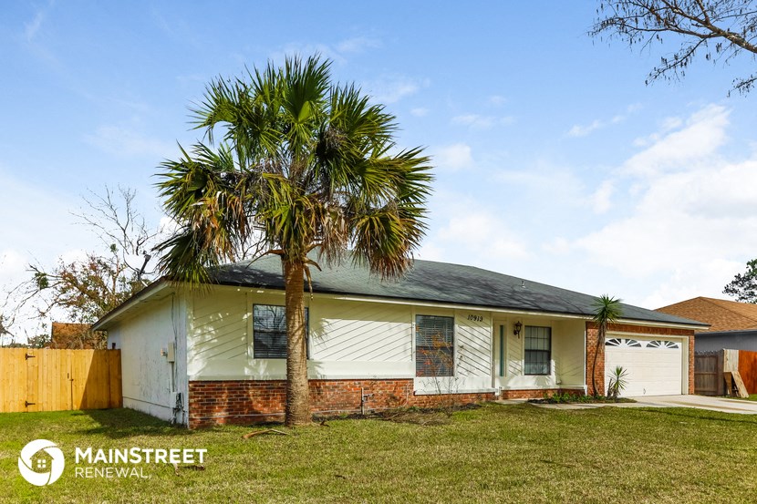 a house with a palm tree in front of it