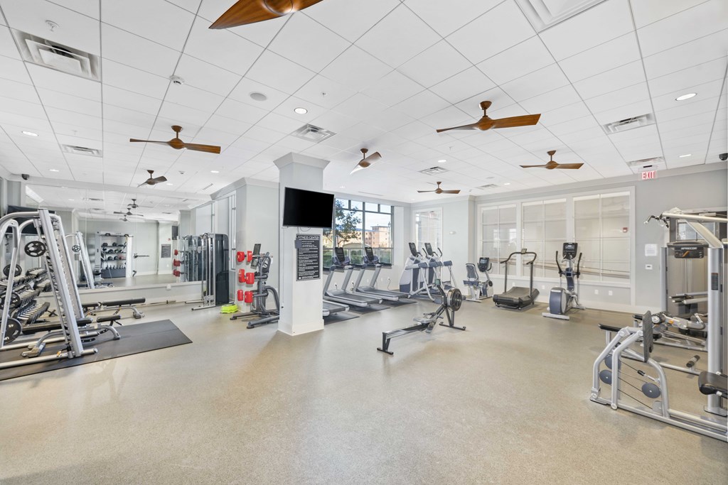 A spacious gym with a variety of equipment and a flat floor.