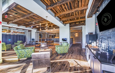 a lobby with a living room and a kitchen