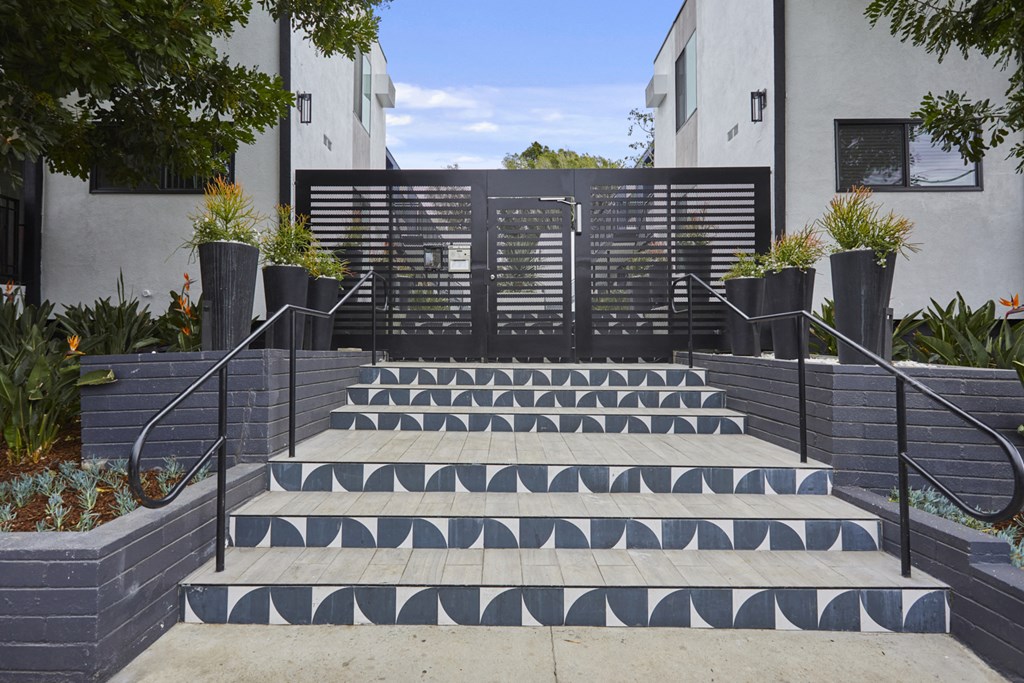 Outdoor steps and gate entering courtyard