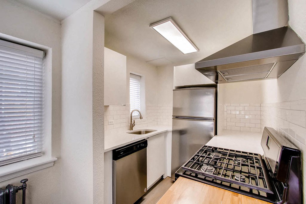 a small kitchen with a stove and a sink