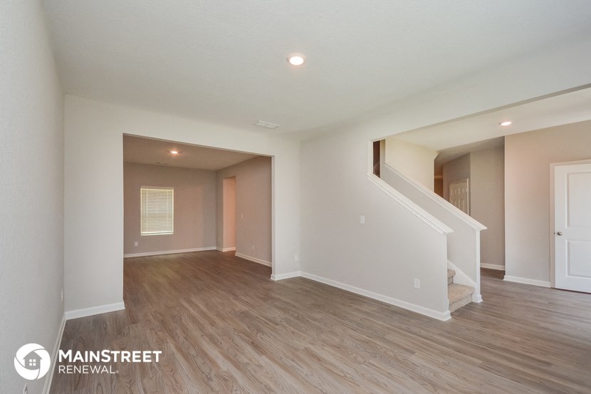 the spacious living room with stairs to the loft