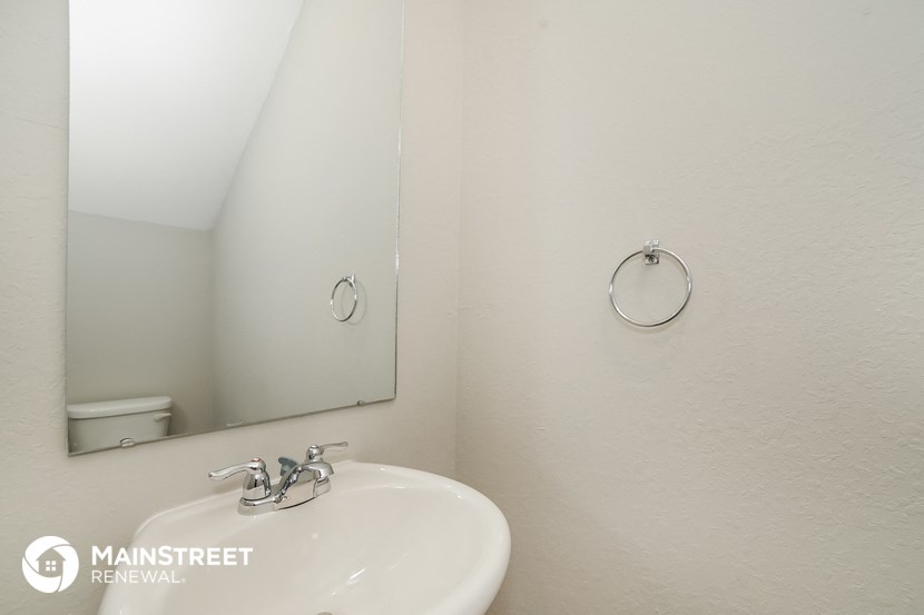 a small bathroom with a sink and a mirror