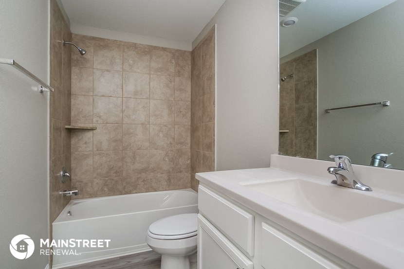 an image of a bathroom with a sink toilet and shower