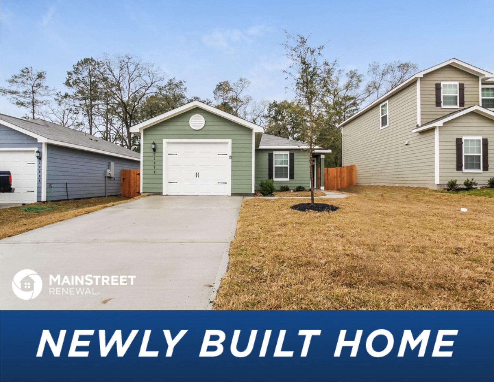 a new build home with a garage and a yard
