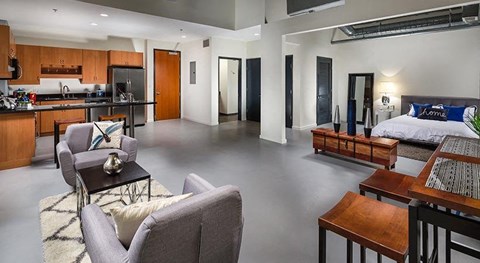 A modern living room with a grey sofa and a coffee table.