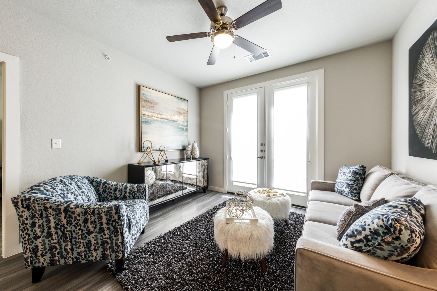 Living room with full-size 3-seated couch, recliner, and cable connections