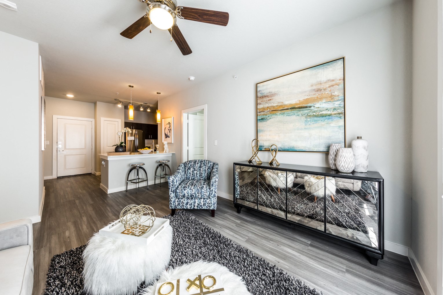 Living room looking into kitchen and doorway to second bedroom