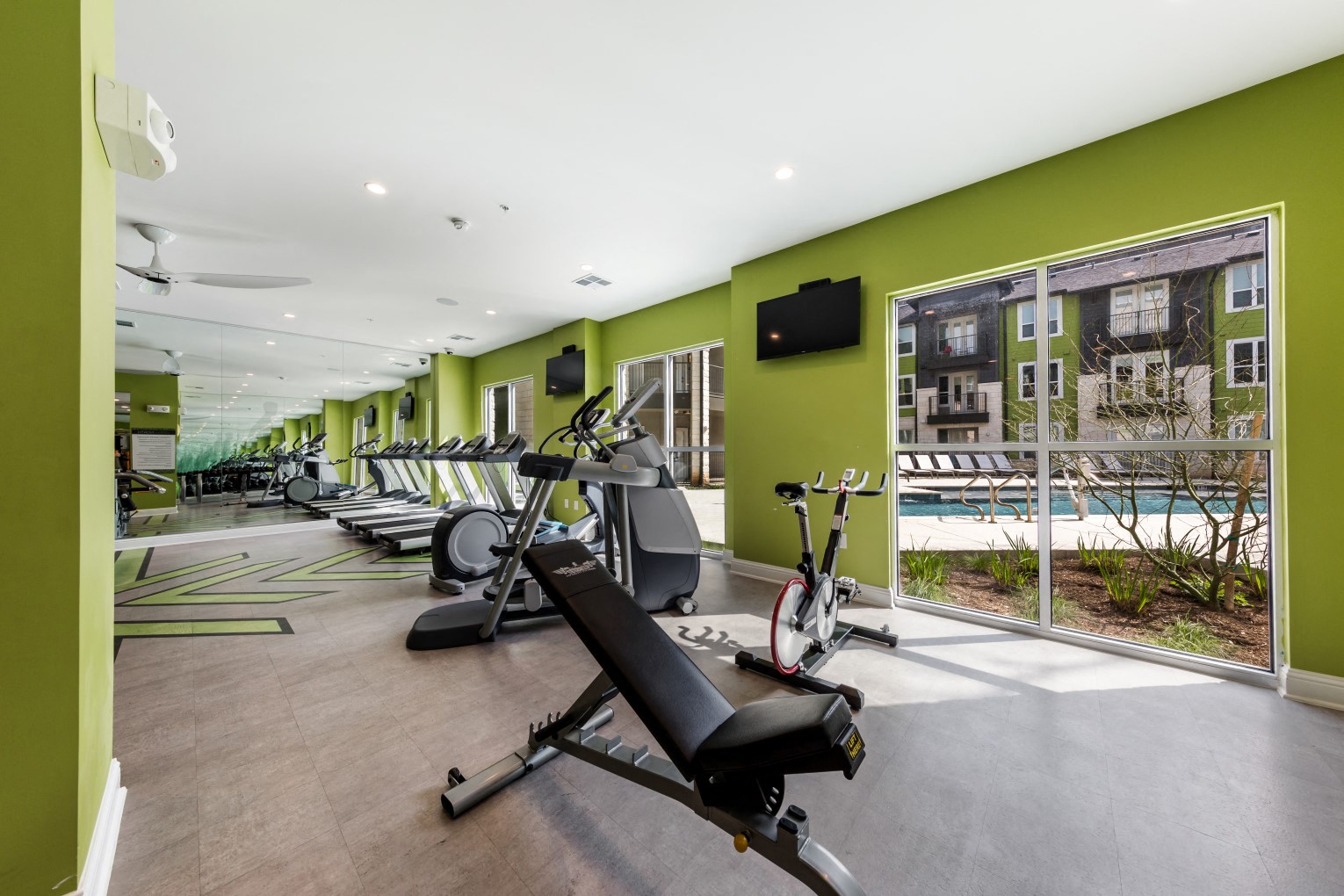 Cardio machine area overlooking the interior pool courtyard