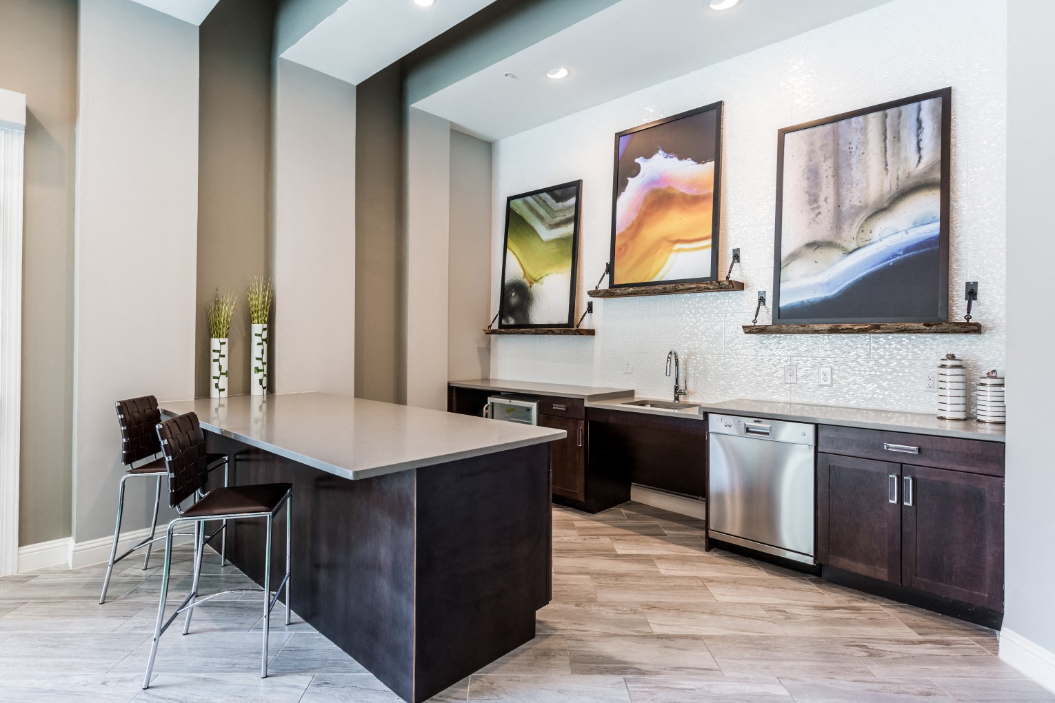 Community kitchen with wood-style flooring, microwave, sink, and dishwasher
