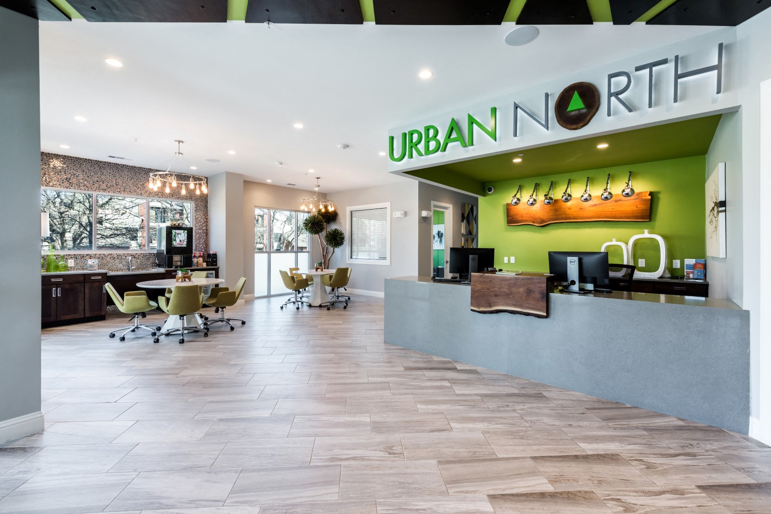 Leasing office with large windows, leasing center, and cafe lounge