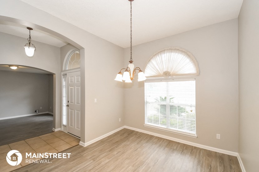 the living room and dining room are open to the kitchen