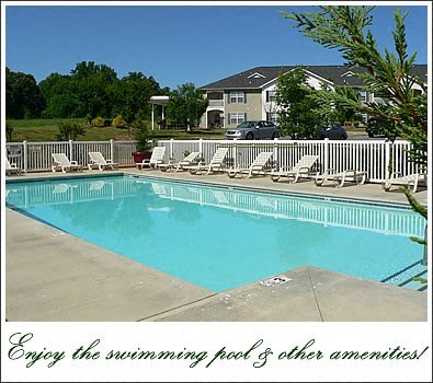 a swimming pool with white chairs