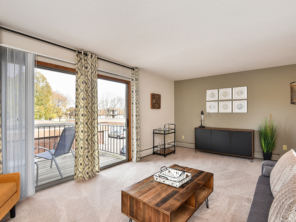 Lancaster Village Apartments - Living Room & Patio