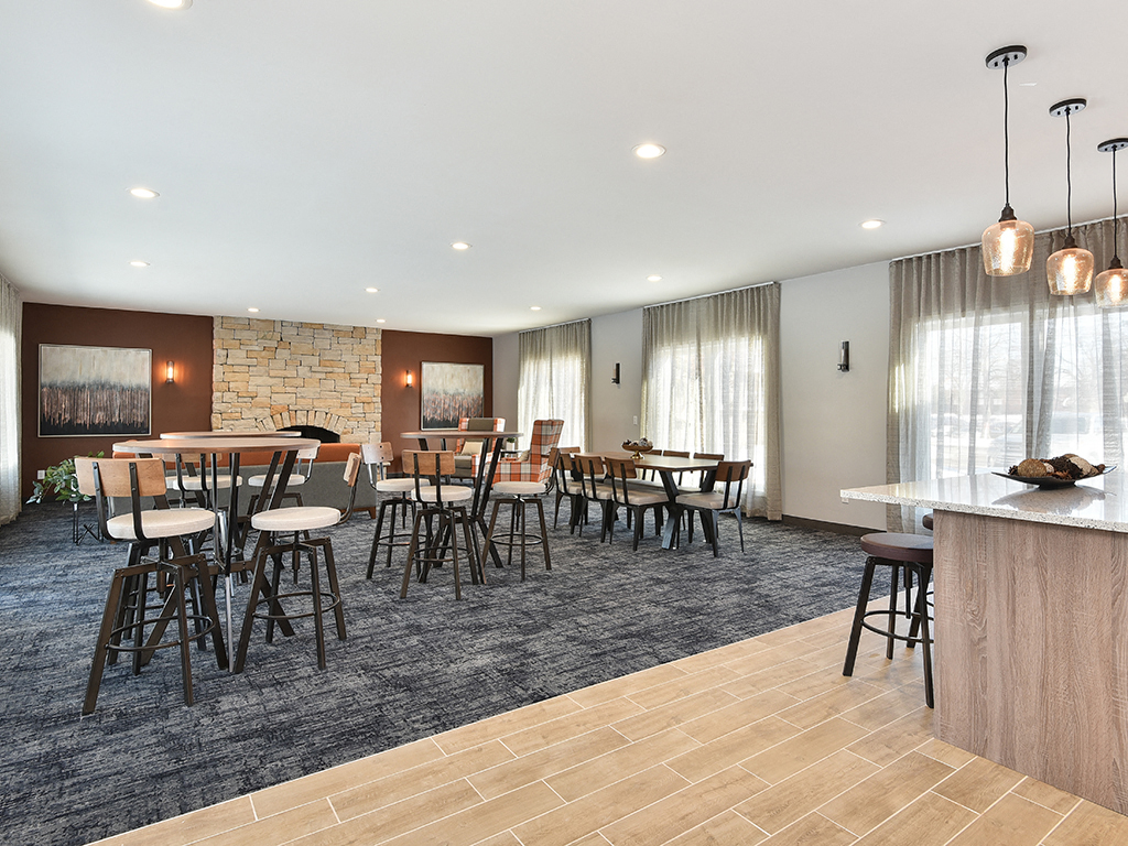 Pines of Burnsville - Clubhouse Seating Area & Fireplace