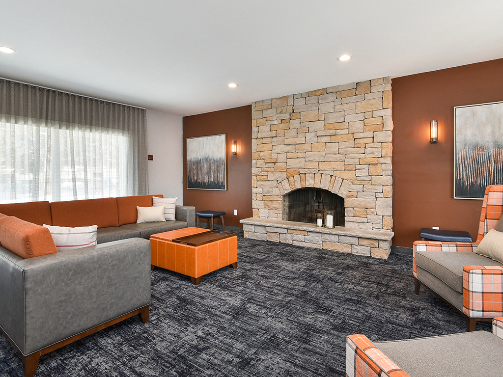 Pines of Burnsville - Clubhouse Seating Area & Fireplace