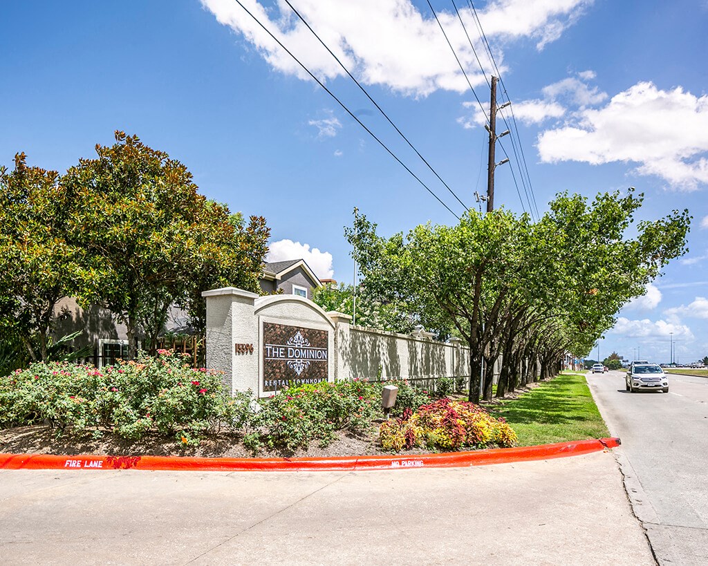 Monument Sign at The Dominion Apartments in Conroe TX