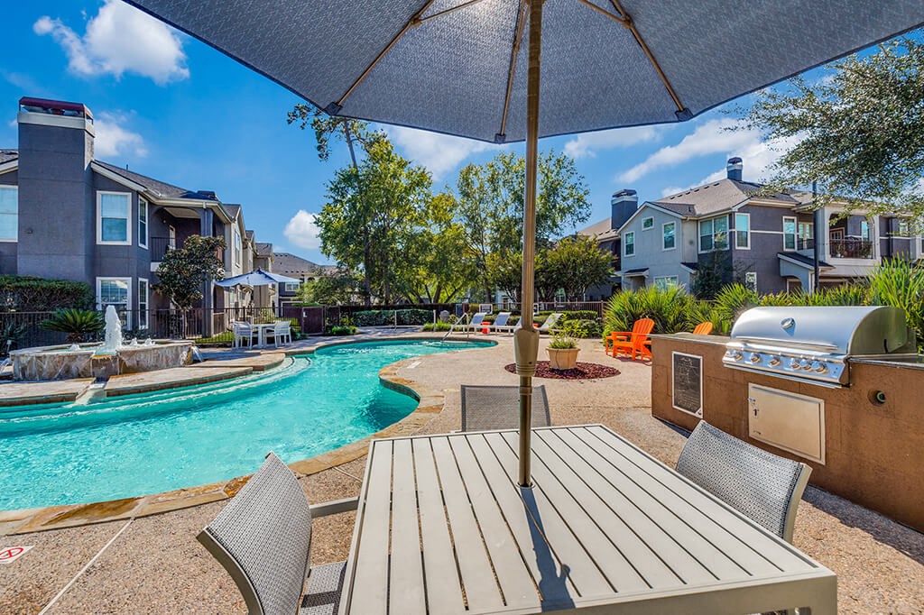 Pool Grilling Area at The Dominion Apartments in Conroe TX