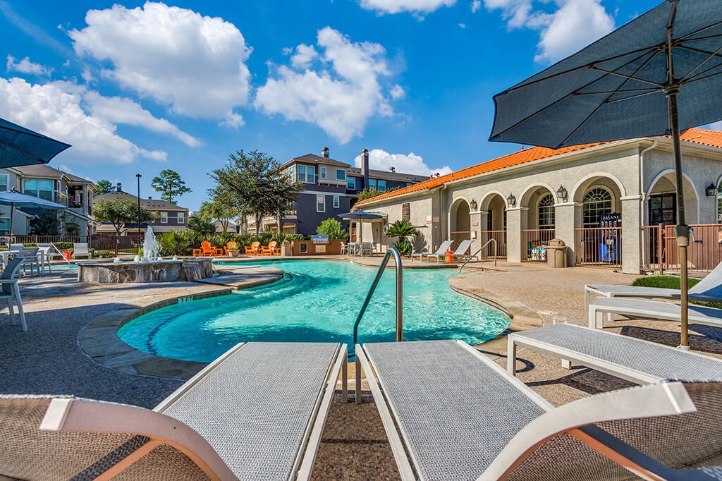 Pool Lounge Chairs at The Dominion Apartments in Conroe TX