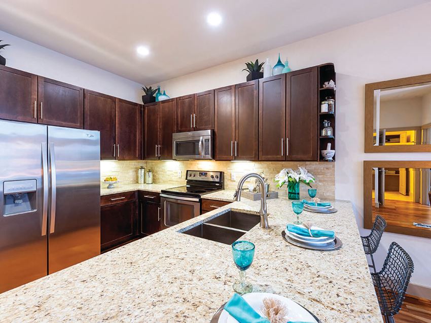 Kitchen with stainless steel appliances at Block 334 Apartments