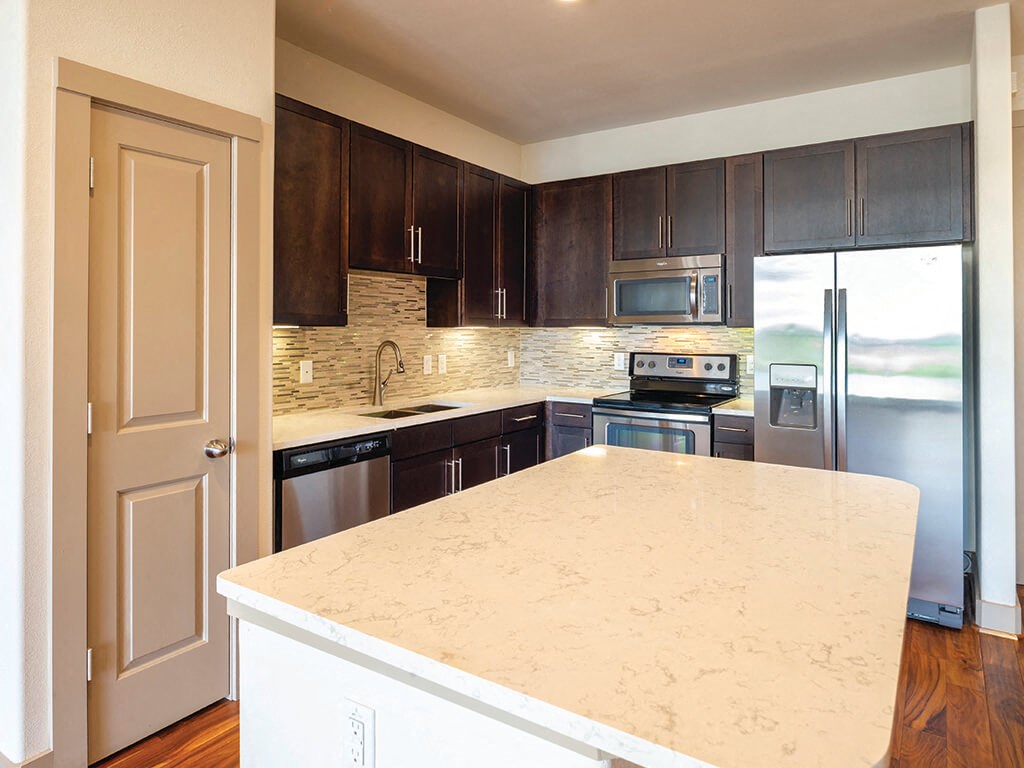 Kitchen with island at Block 334 Apartments