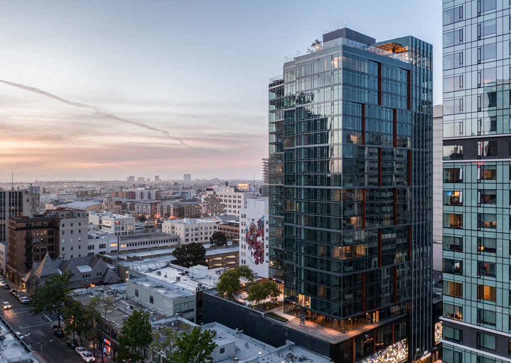 an aerial view of the city at sunset