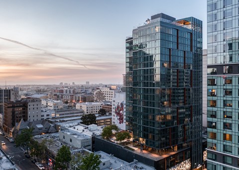 an aerial view of the city at sunset