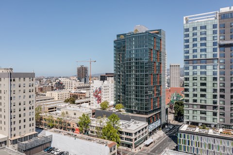 an aerial view of the city with tall buildings