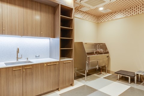 a kitchen with a sink and a counter with a desk