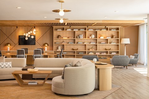 a living room with couches and chairs and a table