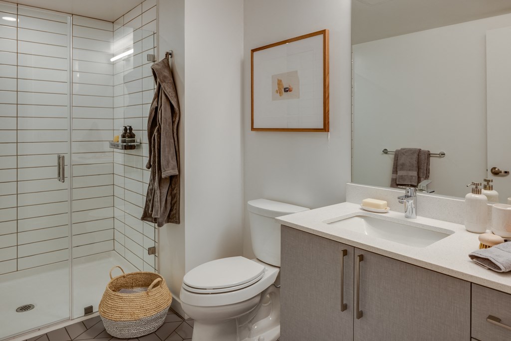 a bathroom with a sink toilet and shower