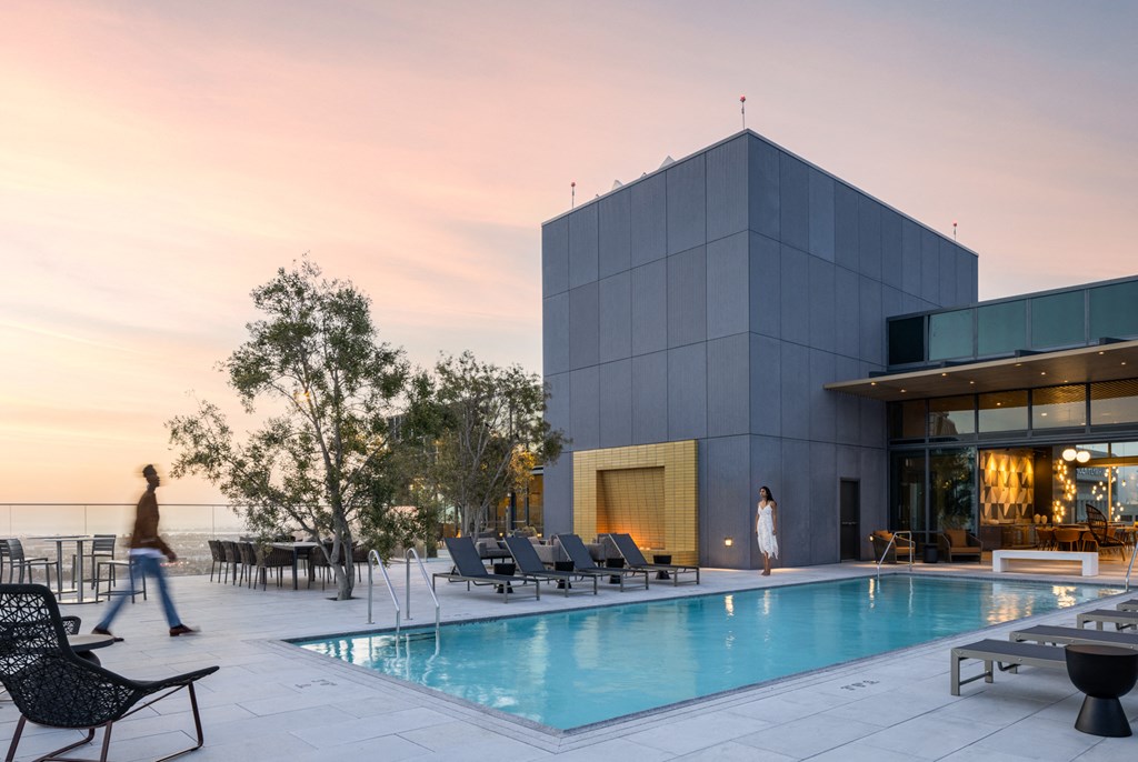 a swimming pool in front of a building