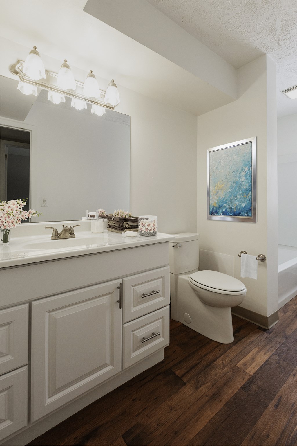 a bathroom with a toilet and a sink and a mirror